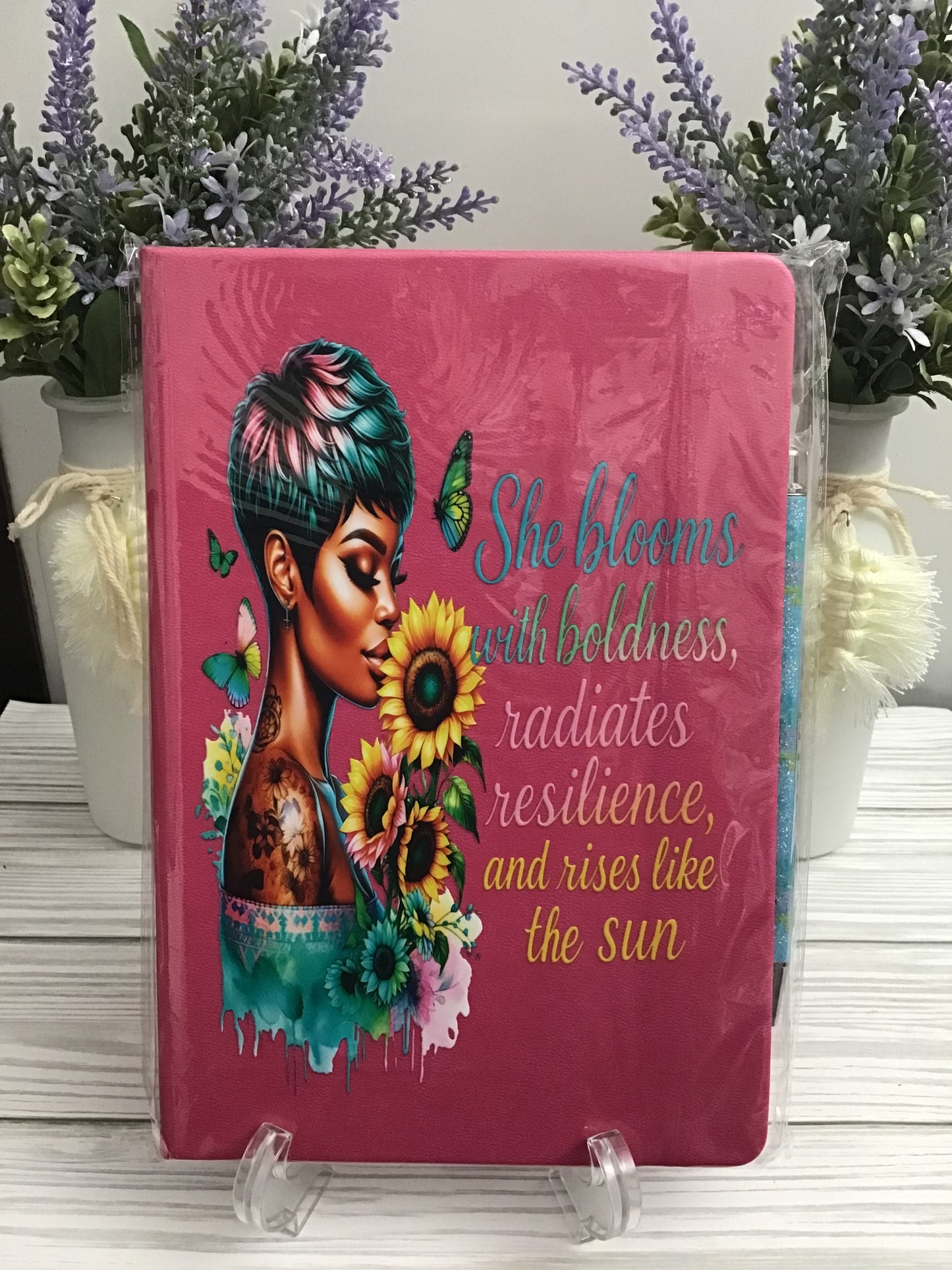 SHE BLOOMS WITH BOLDNESS